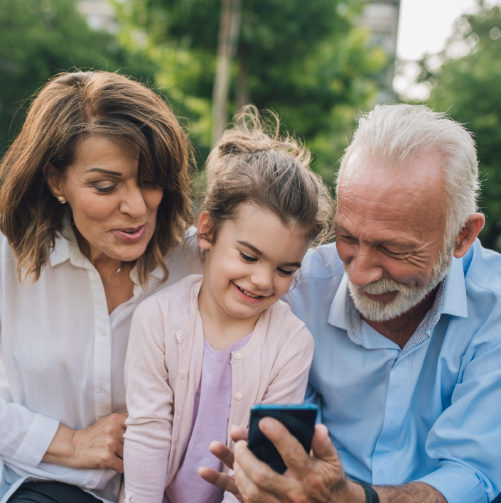 Happy family using mobile phones